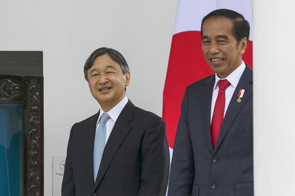 Indonesian President Joko Widodo, right, walks with Japan's Emperor Naruhito during their meeting at Bogor Palace in Bogor, West Java, Indonesia, Monday, June 19, 2023. (Bay Ismoyo/Pool Photo via AP)