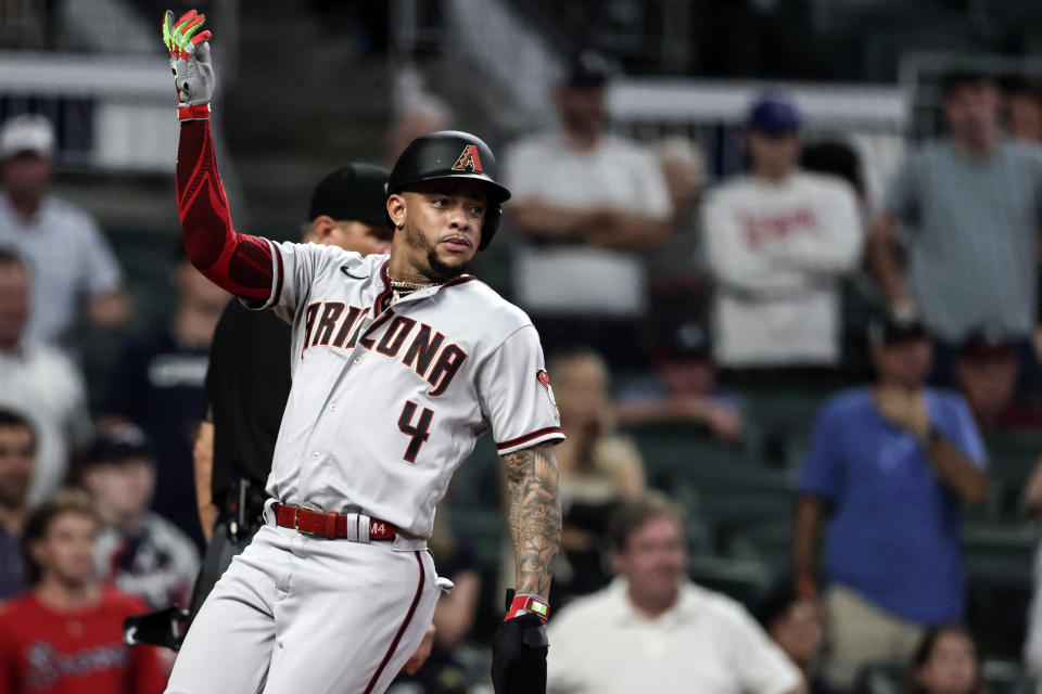 Arizona Diamondbacks' Ketel Marte scores a run against the Atlanta Braves during the ninth inning of a baseball game Saturday, July 30, 2022, in Atlanta. (AP Photo/Butch Dill)