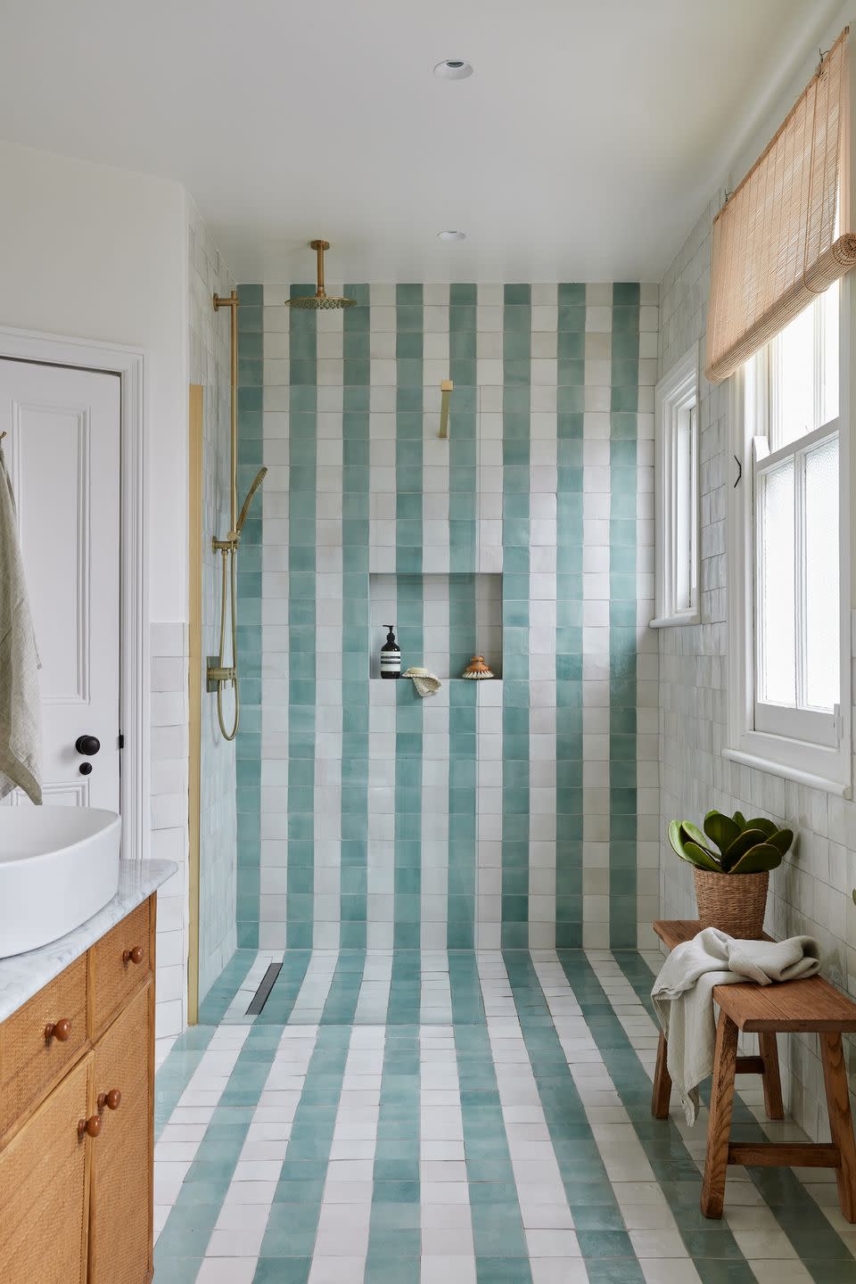 a bathroom with a blue and white checkered floor