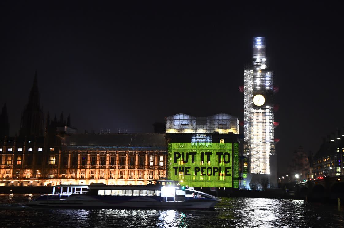 A projection on the Houses of Parliament calling for a second Brexit vote (PA)