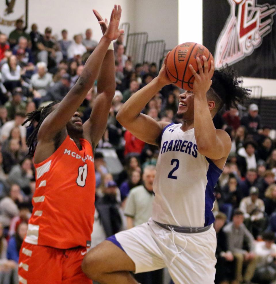 Amauri Truax of Horseheads drives to the basket as McDonogh's Mathani Paul-Swinson defends during the Eagles' 60-44 win in a Boys National Division quarterfinal at the Josh Palmer Fund Clarion Classic on Dec. 28, 2022 at Elmira High School.