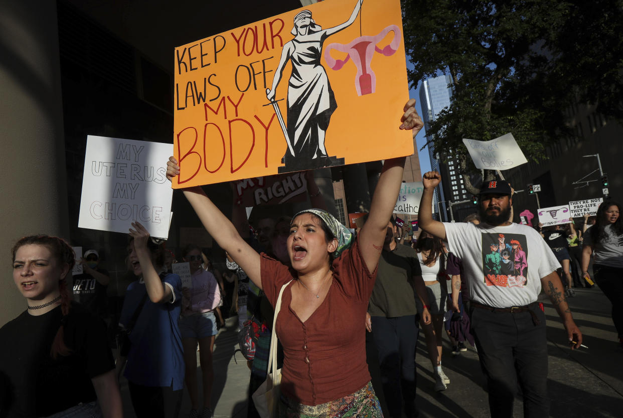 Abortion rights demonstrators gather outside of the federal courthouse in Houston on Tuesday. (Jon Shapley/Houston Chronicle via AP)