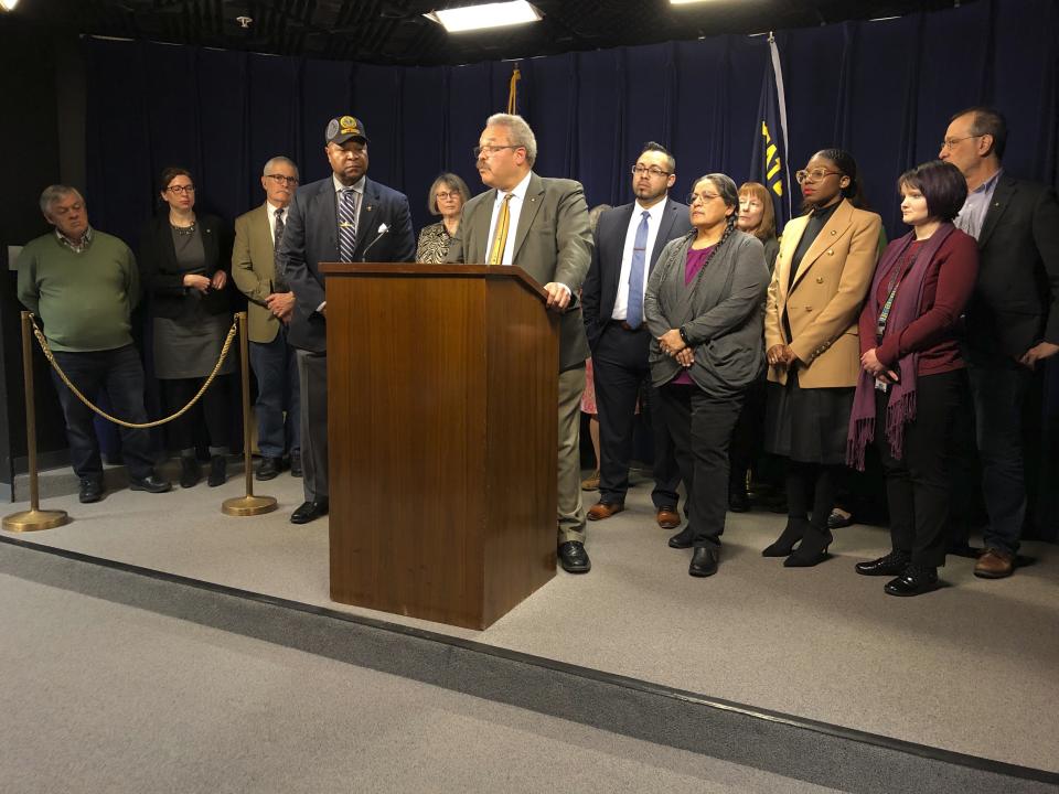 Oregon state Sen. Lew Frederick, a Democrat from Portland, speaks to reporters on Thursday, March 5, 2020, as other Democratic lawmakers look on. At the news conference in the Oregon State Capitol, frustration boiled into the open after Senate Republican Leader Herman Baertschiger, Jr., said his party would return from a boycott of the Legislature on Sunday only to vote on emergency budget bills. Democratic lawmakers said representative democracy is at stake by repeated use of walkouts to deny a quorum and freeze all legislation. Later in the day, the 2020 legislative session ended early over the impasse, with Democratic Senate and House leaders rejecting Baertschiger's proposal.(AP Photo/Andrew Selsky)