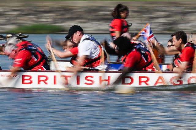 <p>MOHD RASFAN/AFP via Getty Images</p> Prince William joins the Dragon Boat practice in Singapore on Monday