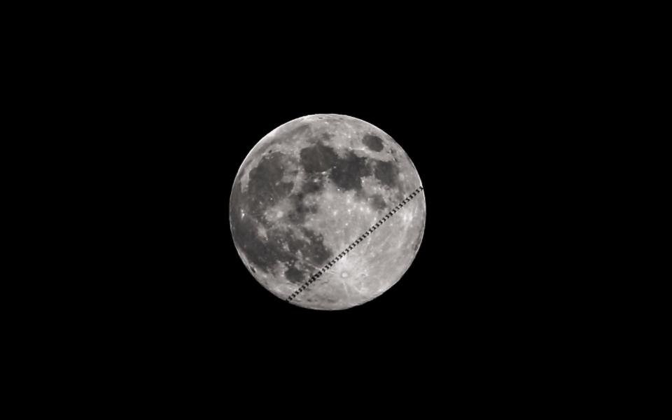 Photographer Fred Pompei captured this image of the International Space Station moving over the face of the "Sap Moon," the last Blue Moon of 2018. Pompei used a William Optics GT71 (400mm f5.9) with a Canon T7i shooting video, with a shutter speed at 1/2000 sec. He also used an Astro-Tech AT6RC astrograph with a ZWO ASI174MM Mini Monochrome Astronomy Camera. <cite>Fred Pompei</cite>