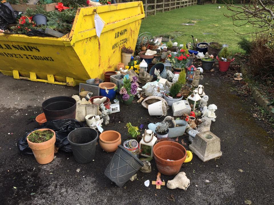 Crosses and ornaments were disposed of in a cemetary skip in Gerrards Cross, Bucks. Angry mourners say they had no warning (Ann Sibley/Facebook)