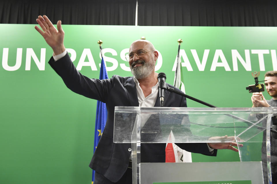 Stefano Bonaccini, president of the Emilia-Romagna Region and Democratic Party candidate, waves to supporters during the closing event of the electoral campaign of the Democratic Party of Emilia-Romagna at the ARCI Benassi club in Bologna, Italy, on Thursday, Jan. 23, 2020. (Massimo Paolone/LaPresse via AP)