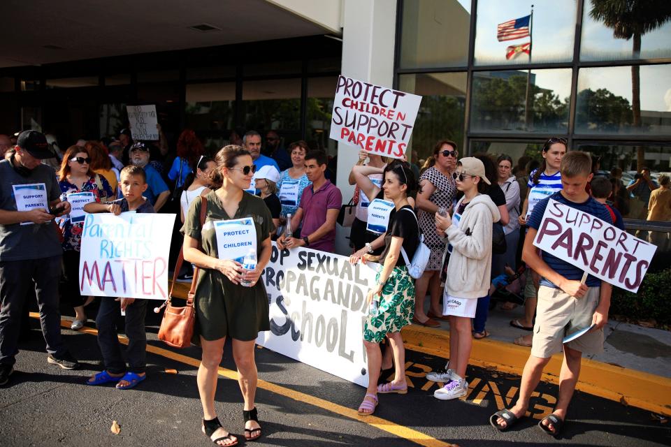 Supporters of the recently-passed education bill hold signs Tuesday, May 3, 2022 at the Duval County Public Schools building in Jacksonville. Hundreds came out to support, protest and speak during the Duval County School Board meeting about their support and disappointment with the State of Florida's Parental Rights in Education Bill Ð who Gov. Ron DeSantis signed the bill into law Ð and overhaul the school district's current LGBTQ+ Support Guide. 