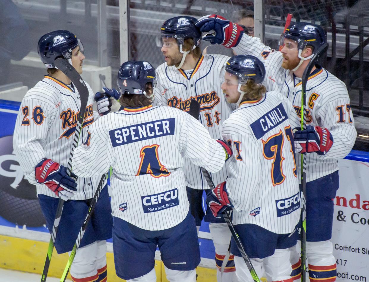 The Peoria Rivermen celebrate Braydon Barker's (18) goal against Quad City in the first period of their SPHL hockey game Saturday, April 6, 2024 at the Peoria Civic Center.