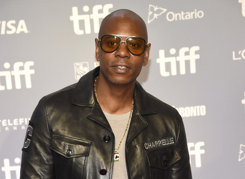 FILE - Actor-comedian Dave Chappelle attends the press conference for "A Star Is Born" at the Toronto International Film Festival in Toronto on Sept. 9, 2018. Critics and supporters of Chappelle’s Netflix special that included anti-transgender comments gathered outside the company’s offices Wednesday, Oct. 20, 2021, with “Trans Lives Matter” and “Free Speech is a Right” among their competing messages. (Photo by Evan Agostini/Invision/AP, File)