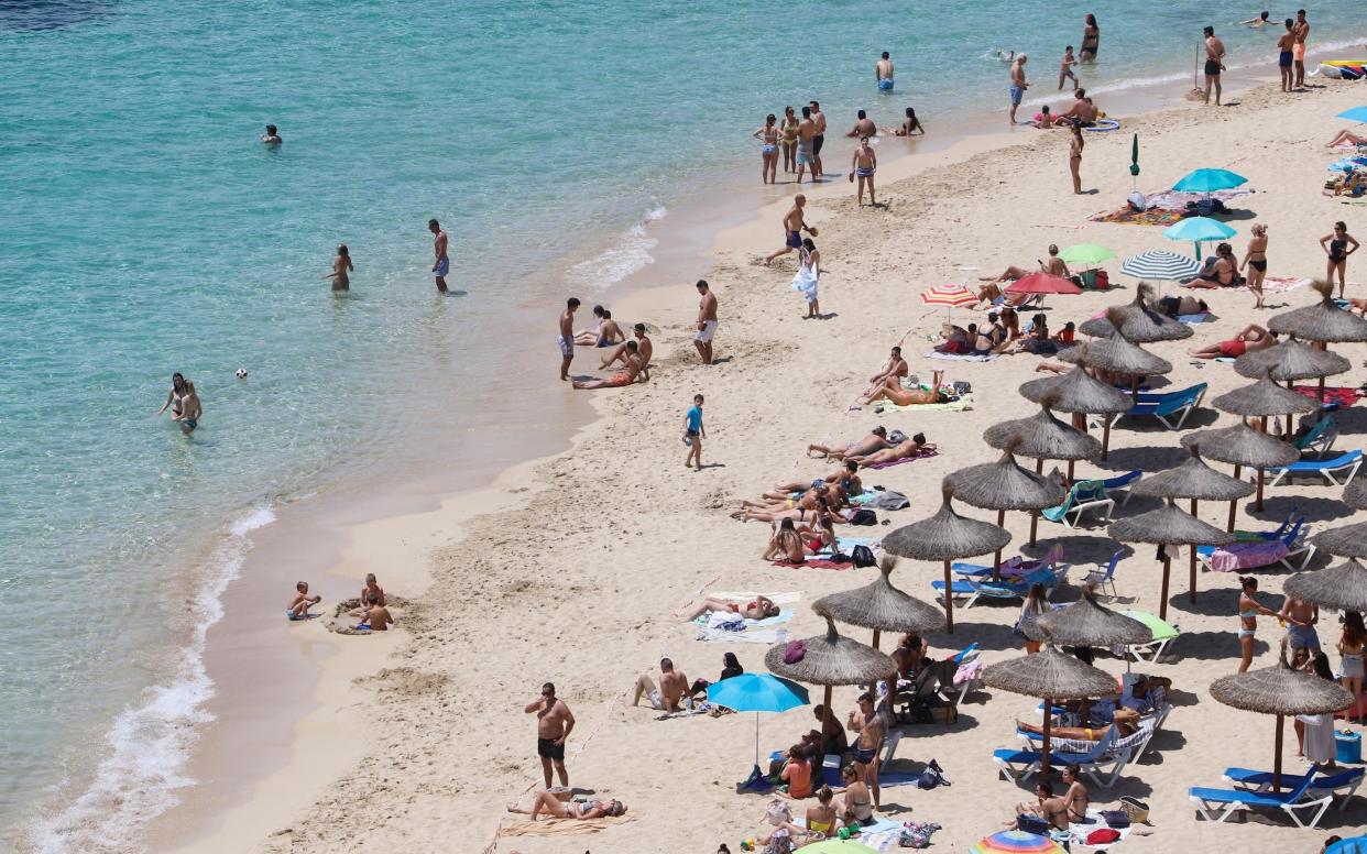 A sunny holiday in Spain could leave you with mask tan lines - CLARA MARGAIS/GETTY