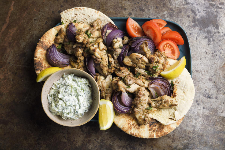 This image released by Milk Street shows a recipe for chicken souvlaki with tzatziki. (Milk Street via AP)