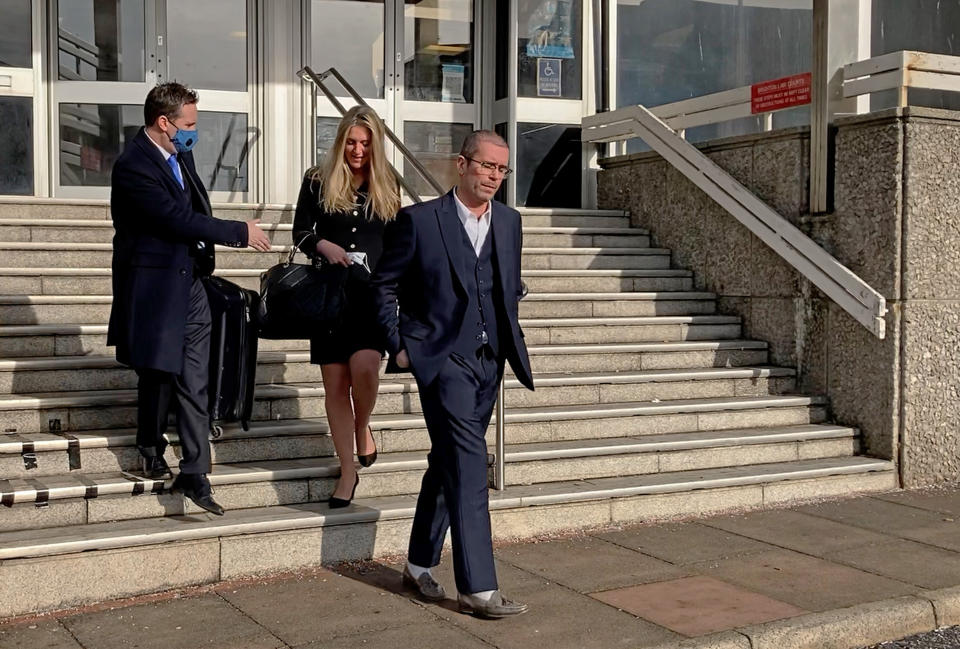 Grab from PA video of Alan Carr's husband Paul Drayton (right) leaving Brighton Crown Court after winning his appeal against a prison sentence for drink-driving. He had been jailed on Wednesday for 14 weeks after pleading guilty to drunkenly reversing into a police car with an alcohol test reading 