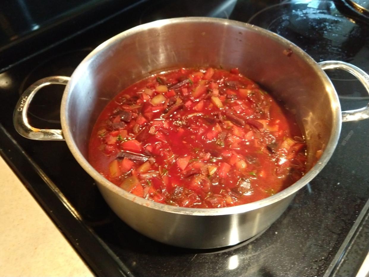 Borscht consists of beets, carrots, onion, broth, cabbage, potato and more.