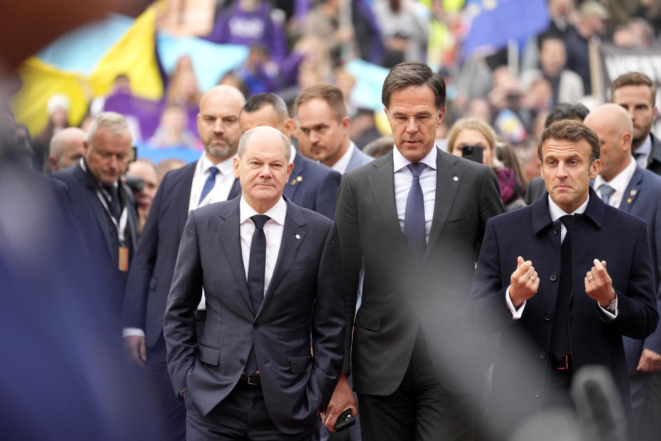 From left, Germany's Chancellor Olaf Scholz, Netherland's Prime Minister Mark Rutte and French President Emmanuel Macron arrive for an EU Summit at Prague Castle in Prague, Czech Republic, Friday, Oct 7, 2022. European Union leaders converged on Prague Castle Friday to try to bridge significant differences over a natural gas price cap as winter approaches and Russia's war on Ukraine fuels a major energy crisis. (AP Photo/Darko Bandic)