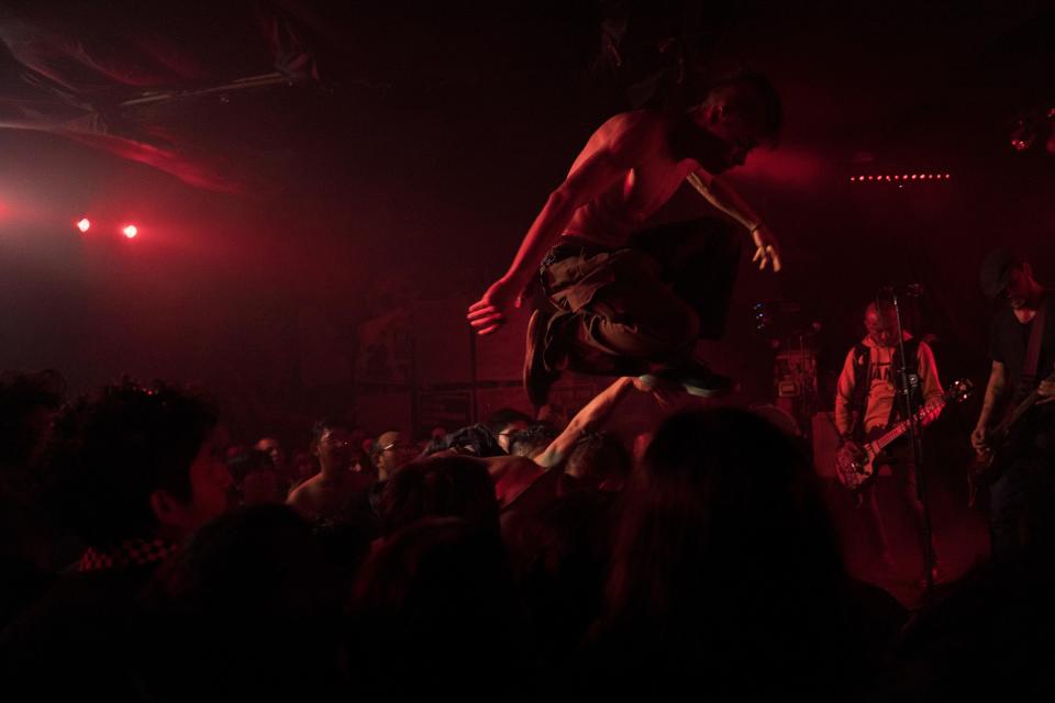 Fans of the Mexican Punk Rock band Seguimos Perdiendo dance during one of the last active weekends at the iconic counterculture venue Multiforo Alicia in Mexico City, Friday, Feb. 17, 2023. The narrow concert hall sheltered important Mexican bands like Panteon Rococo, Sekta Core, Botellita de Jerez, Lost Acapulco and Tijuana No! and hosted international artists like Manu Chao, Ska-P and Banda Bassotti. (AP Photo/Eduardo Verdugo)