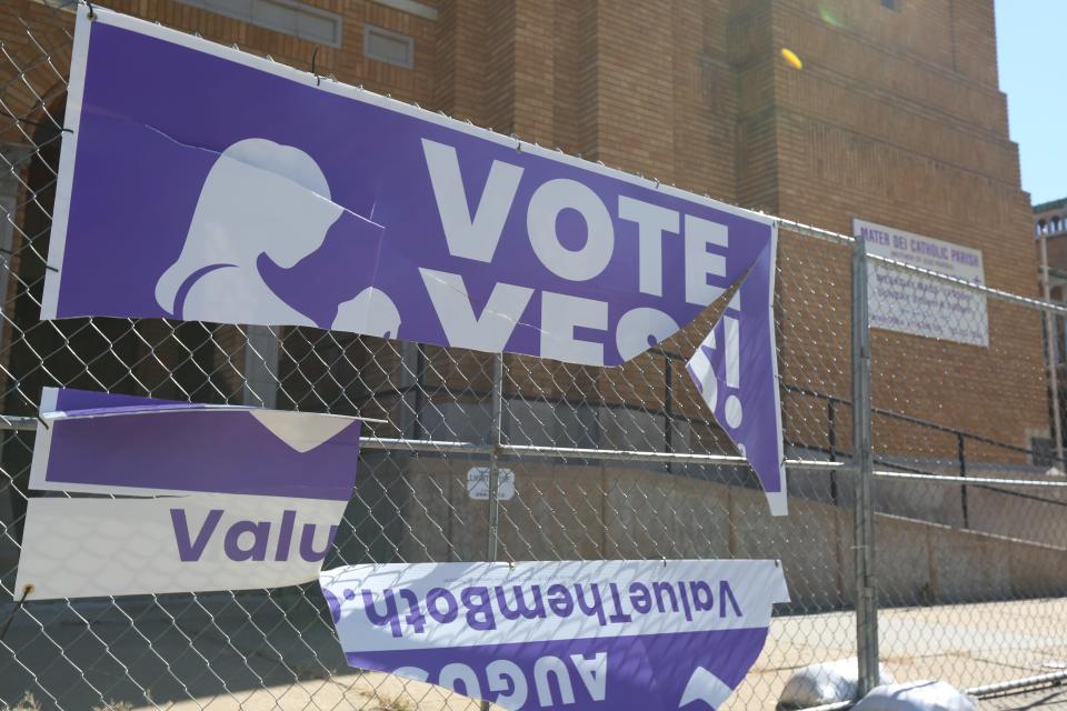 A sign in support of an anti-abortion amendment to the Kansas Constitution is seen Tuesday outside Assumption Church in Topeka.