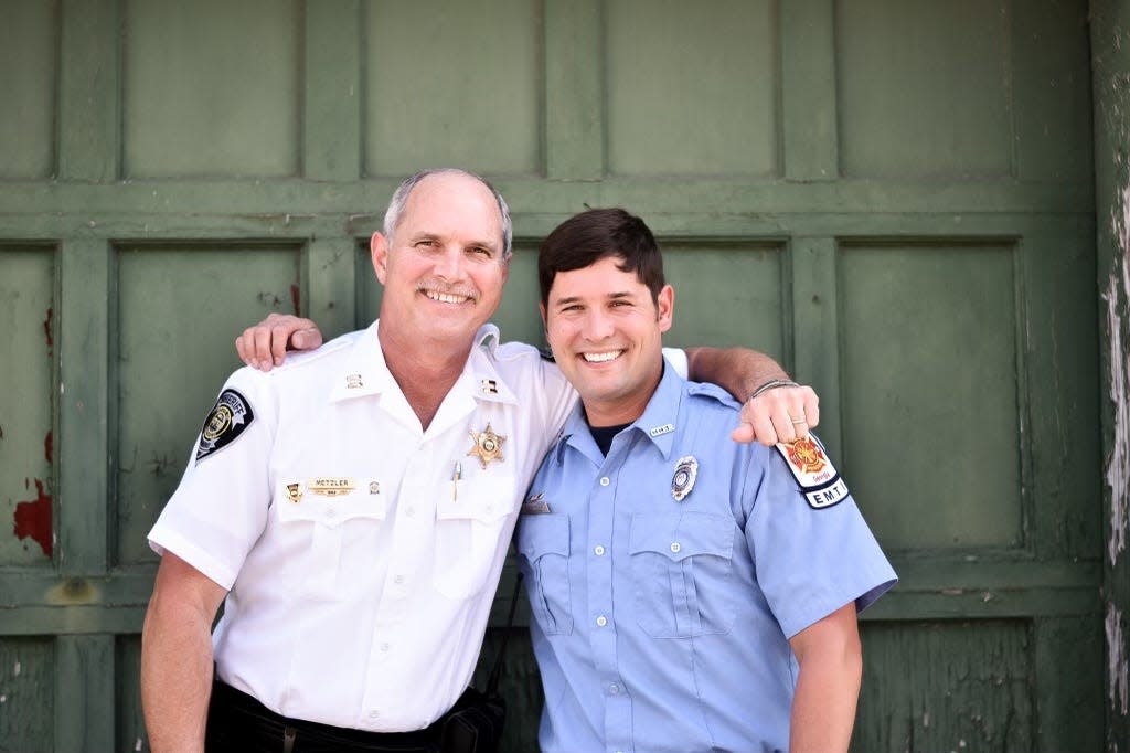 Lt. Rushton Metzler with Columbia County Fire Rescue poses with his father, who has served with the Richmond County Sheriff's Office for more than 40 years.