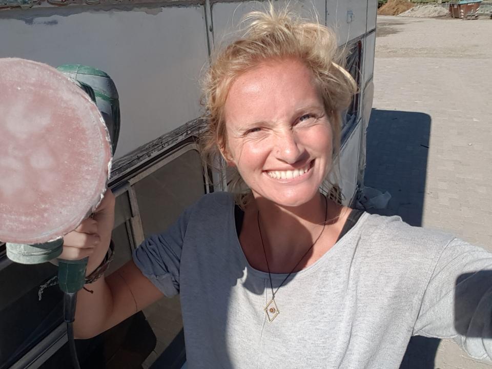 Saskia van Leuween holding a power sander