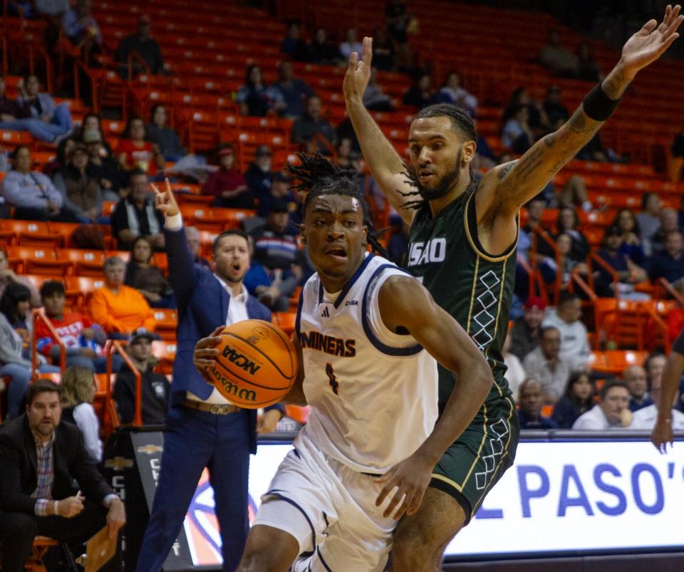 UTEP's Corey Camper Jr. (4) attempts to get past a University of Science and Arts of Oklahoma defender at the Don Haskins Center on Nov. 9, 2023.