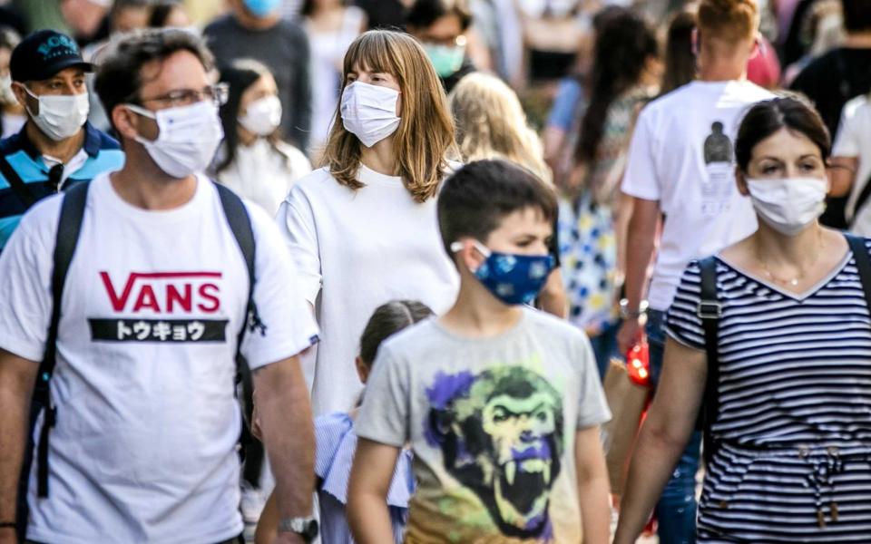 People in masks - Remko de Waal/EPA-EFE/Shutterstock