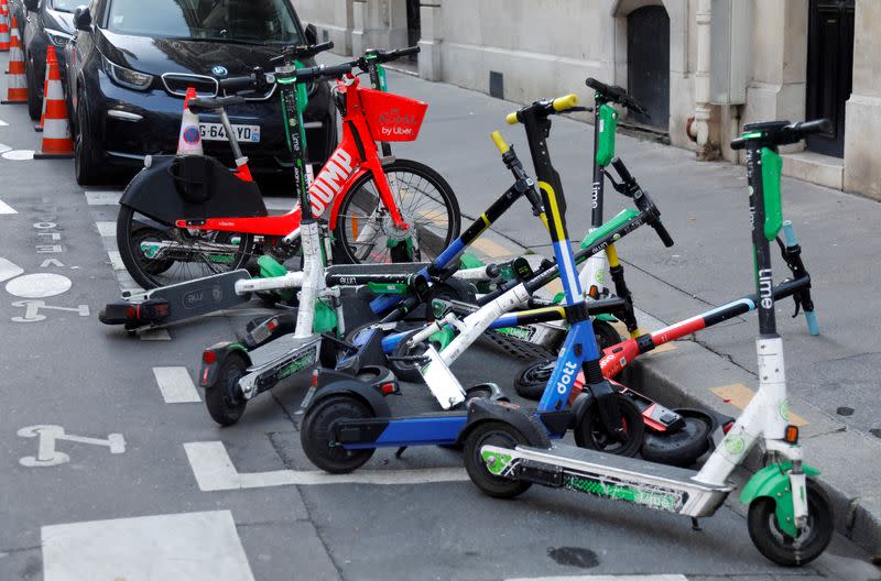 FILE PHOTO: Dock-free electric scooters parked in Paris