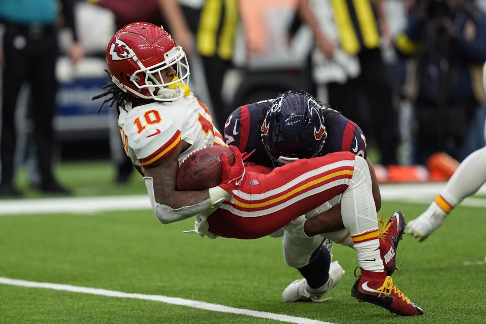 Kansas City Chiefs running back Isiah Pacheco (10) his hit by Houston Texans defensive end Troy Hairston (34) on a kickoff return during the second half of an NFL football game Sunday, Dec. 18, 2022, in Houston. (AP Photo/David J. Phillip)