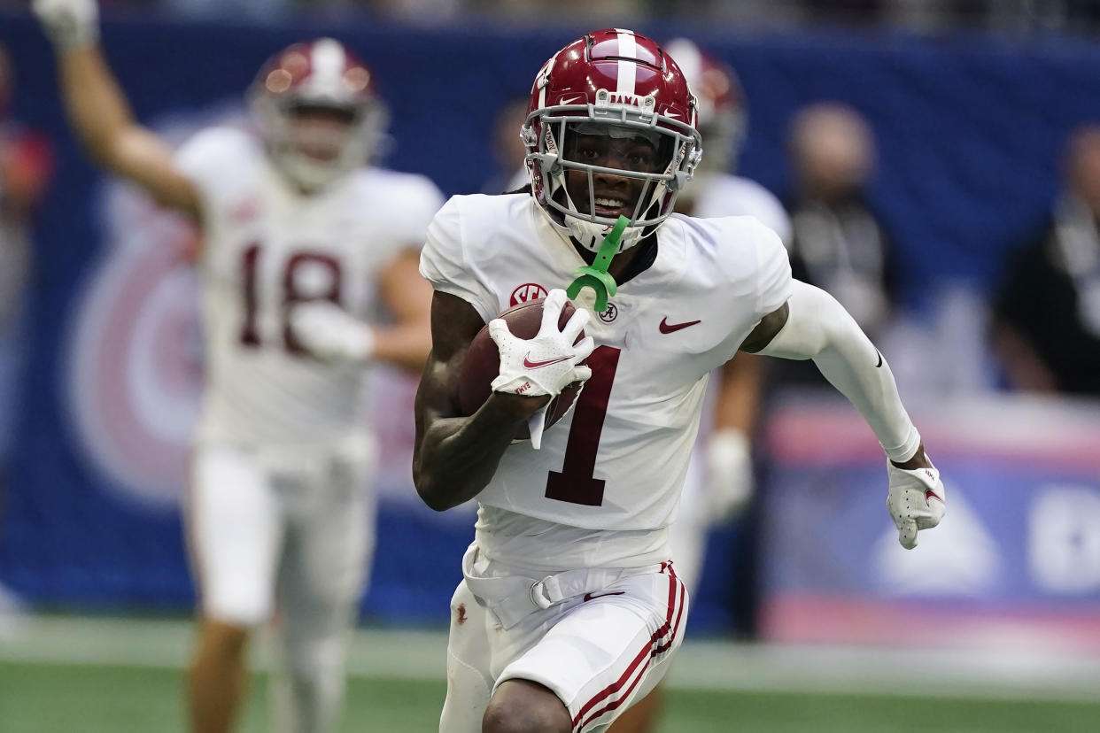 FILE - Alabama wide receiver Jameson Williams (1) scores a touchdown against the Miami during an NCAA college football game Saturday, Sept. 4, 2021, in Atlanta. Williams was selected to The Associated Press All-SEC team in results released Wednesday, Dec. 8, 2021. (AP Photo/John Bazemore, File)