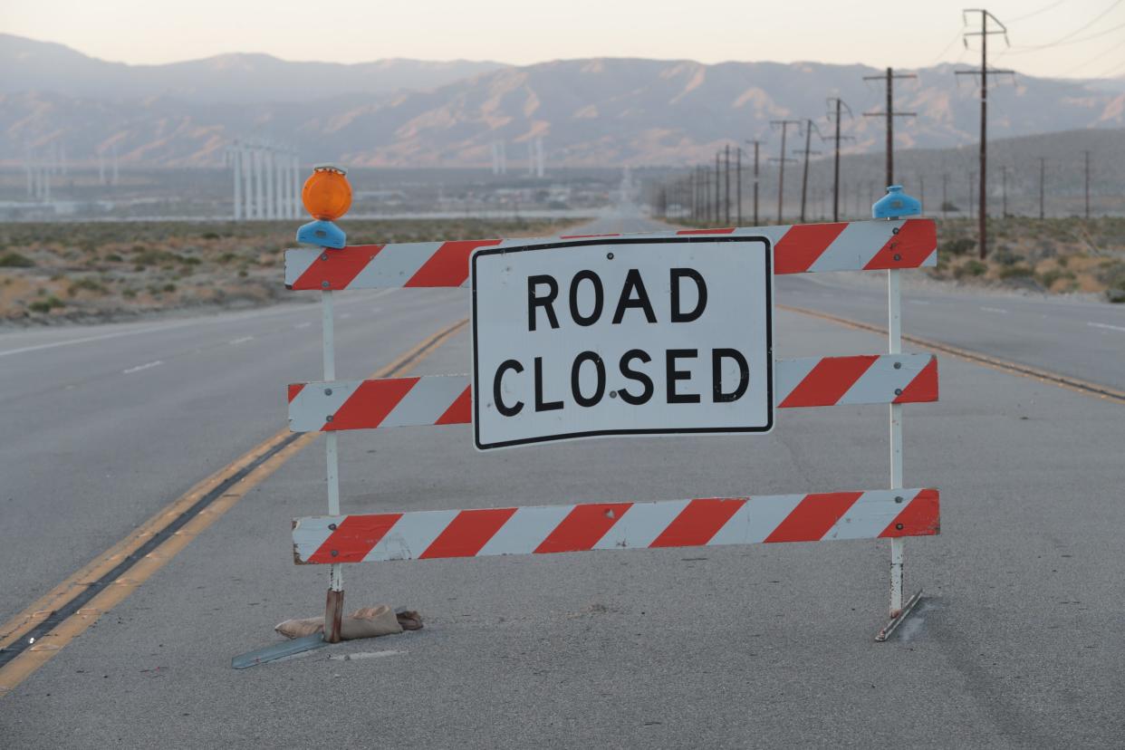 A road closure sign on Indian Canyon Drive. The road was closed through the wash because of blowing sand on Sunday,