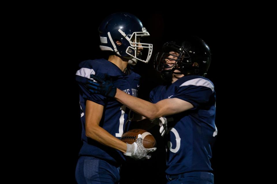 Pleasant Hill’s Brennan Bell, right, and Travis Gielish celebrate a touchdown catch by Gielish. The Banks Braves defeated the Pleasant Hill Billies 42-6 in Pleasant Hill Friday, Sept. 23, 2022. 