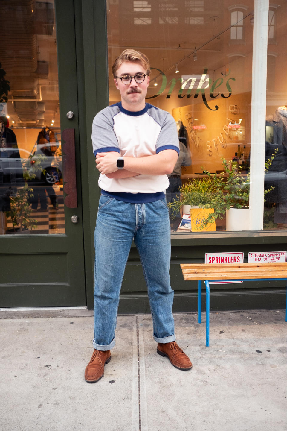 man in nyc with jeans and boots