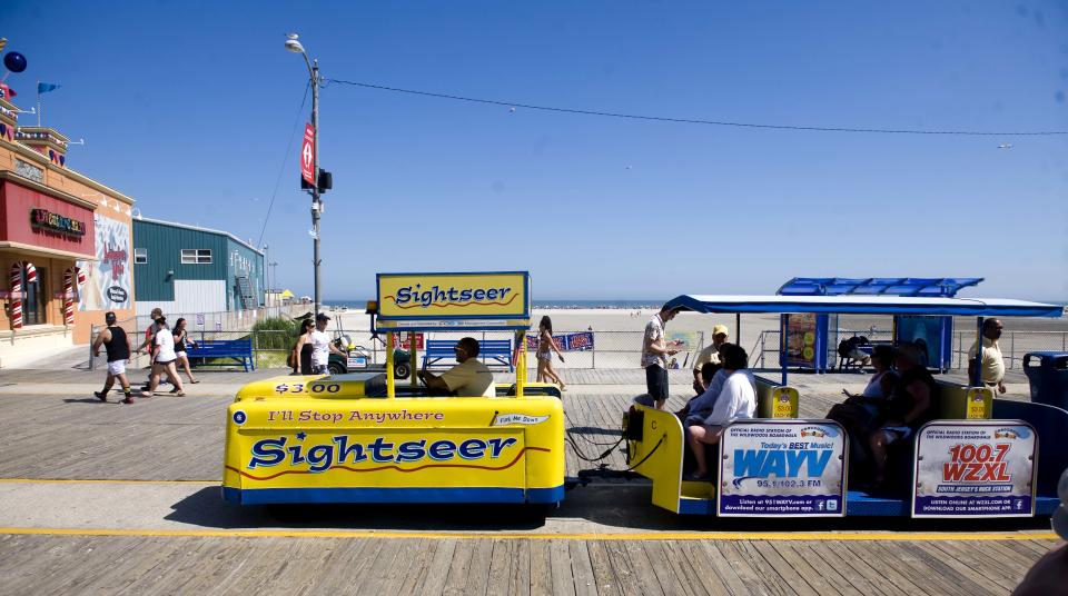 The tram car, an icon of the Wildwood boardwalk dating back to 1949, travels the boards in this 2013 photo. The cars originally were built for the 1939 New York World's Fair.