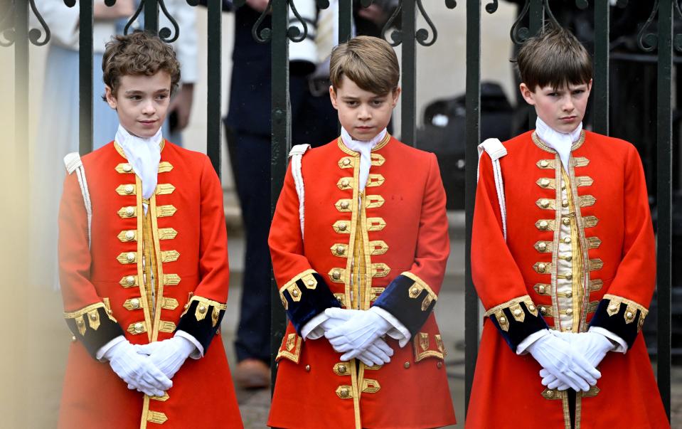 Prince George (center) stands at the Coronation of King Charles III and Queen Camilla on May 6, 2023 in London, England.