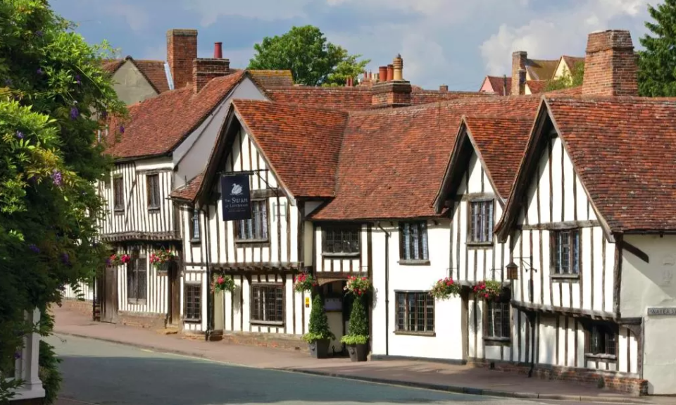 <p><a href="https://www.booking.com/hotel/gb/theswanlavenham.en-gb.html?aid=1922306&label=staycation-uk" rel="nofollow noopener" target="_blank" data-ylk="slk:The Swan;elm:context_link;itc:0;sec:content-canvas" class="link ">The Swan</a>’s timber-framed set of buildings look as though they are straight out of the pages of a quaint story book and occupy pride of place within the old Tudor wool village of Lavenham. </p><p>The village itself - whose main square is just 30 seconds walk away - boasts a famous bakery serving all manner of sandwiches and sweet treats, the notable Guildhall and a 15th-century church, all encircled by half-timbered medieval cottages.</p><p>In the medieval period it was among the 20 wealthiest settlements in England and The Swan certainly upholds an air of refined charm. </p><p>Service is friendly and professional, and the hotel has a bar, two restaurants, two car parks, a spa and garden and a very comfy lounge that wraps around most of the ground floor.</p><p>The spa, a relatively recent addition, with its ultra-modern facilities is in stark contrast to the creaky, wood-clad corridors of the original building, but the two seem to merge seamlessly. </p><p><a class="link " href="https://www.goodhousekeepingholidays.com/offers/suffolk-swan-at-lavenham-hotel-spa" rel="nofollow noopener" target="_blank" data-ylk="slk:READ OUR REVIEW;elm:context_link;itc:0;sec:content-canvas">READ OUR REVIEW</a></p><p><a class="link " href="https://www.booking.com/hotel/gb/theswanlavenham.en-gb.html?aid=1922306&label=staycation-uk" rel="nofollow noopener" target="_blank" data-ylk="slk:BOOK A ROOM;elm:context_link;itc:0;sec:content-canvas">BOOK A ROOM</a></p>