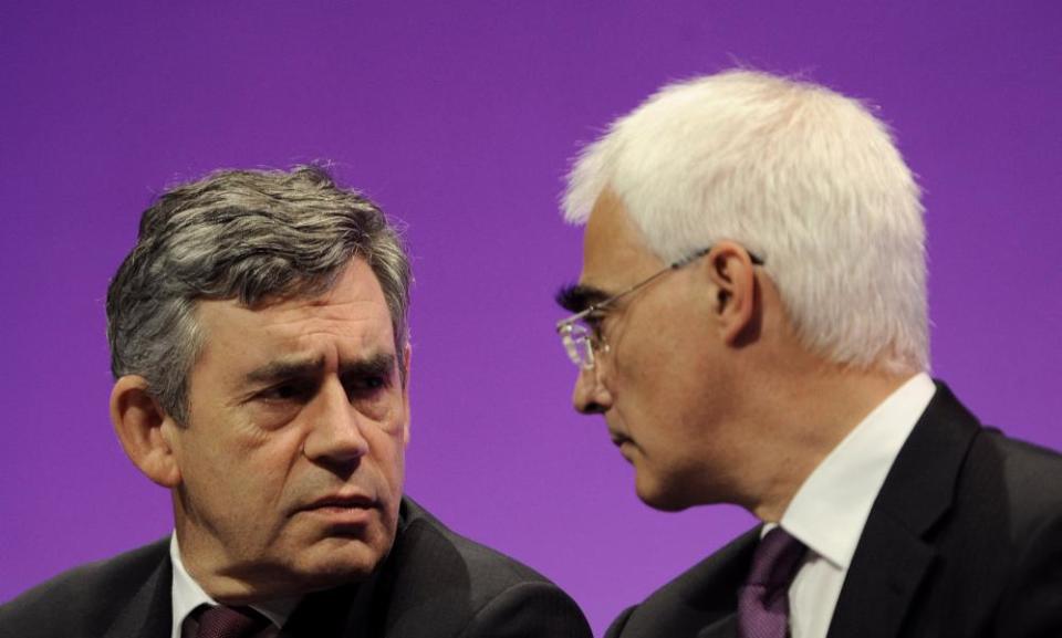 Chancellor Alistair Darling speaks with the then prime minister Gordon Brown in 2008