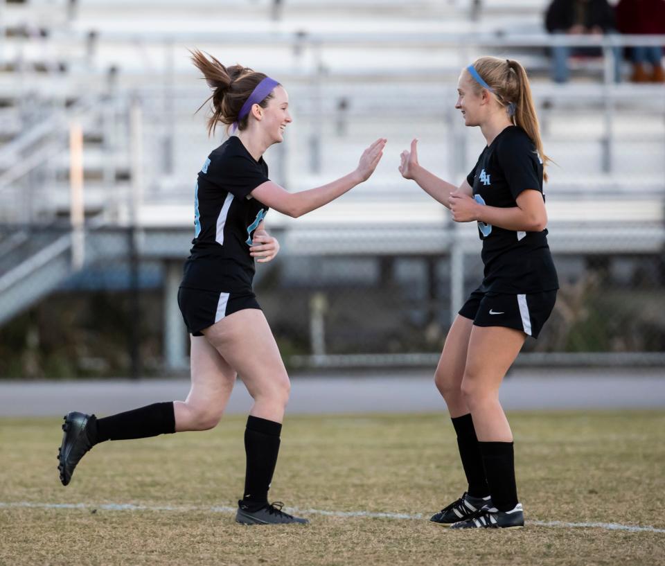 Buccaneer Megan Meyer celebrates her goal with teammate Everett Dent in the first period. North Bay Haven took on Bay High at Gavlak Stadium Monday, November 29, 2021.