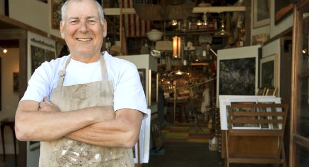 Antique business store owner smiling