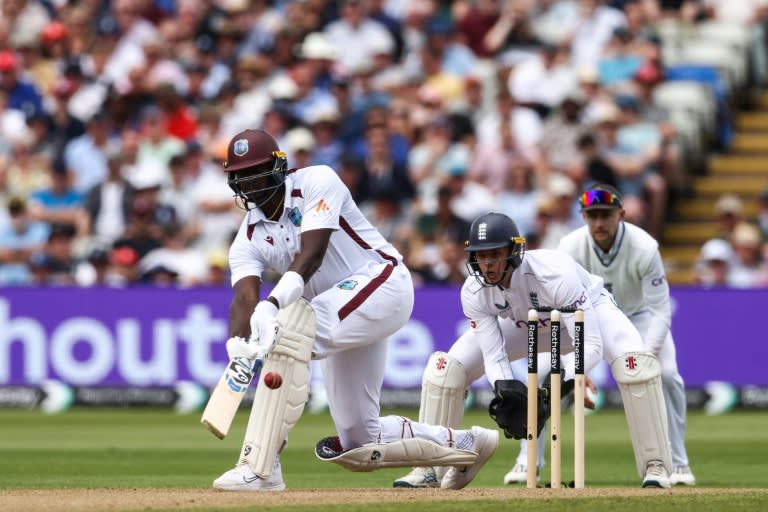 Counter-attack: West Indies' Jason Holder (L) hits out against England in the third Test at Edgbaston as wicketkeeper Jamie Smith looks on (Darren Staples)