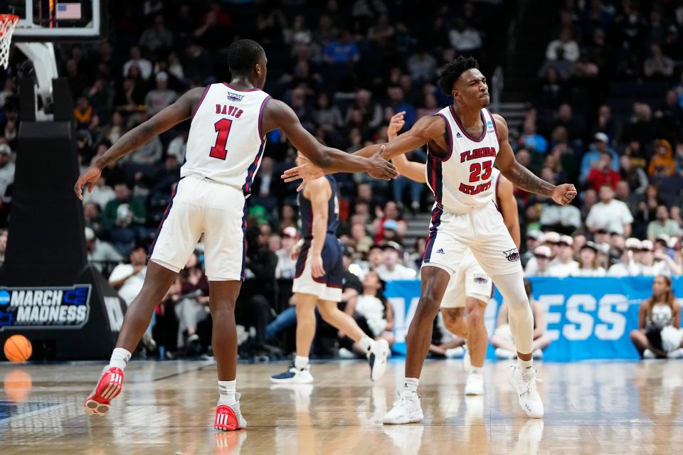 Mar 19, 2023; Columbus, Ohio, USA;  Florida Atlantic Owls guard Brandon Weatherspoon (23) celebrates a three pointer with guard Johnell Davis (1) during the second round of the NCAA men’s basketball tournament against the Fairleigh Dickinson Knights at Nationwide Arena. Mandatory Credit: Adam Cairns-The Columbus Dispatch