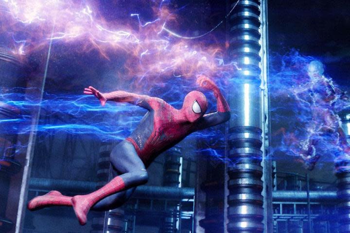 Spider-Man swinging by Electro in "The Amazing Spider-Man 2."