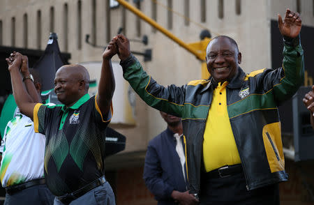 FILE PHOTO: South African President Cyril Ramaphosa and Deputy President David Mabuza arrive to address supporters of the ruling African National Congress (ANC) at an election victory rally in Johannesburg, South Africa, May 12, 2019. REUTERS/Mike Hutchings/File Photo