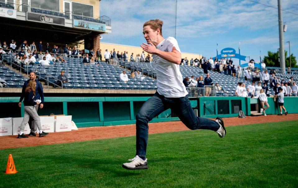 Caron Lieberman, 18, runs a 40-yard dash at Medlar Field on Saturday, Sept. 24, 2022. Penn State fans were challenged to try to beat Chad Powers time.