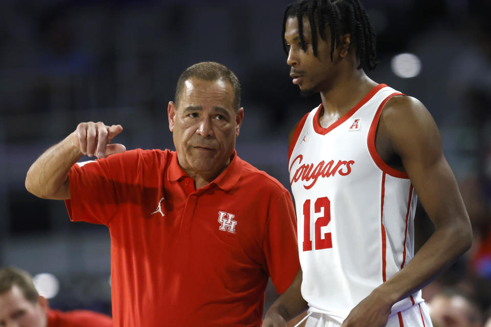 Houston head coach Kelvin Sampson, left, talks with guard Tramon Mark (12) during an NCAA college basketball game against Cincinnati during the second half in the semifinals of the American Athletic Conference Tournament, Saturday, March 11, 2023, in Fort Worth, Texas. (AP Photo/Ron Jenkins)