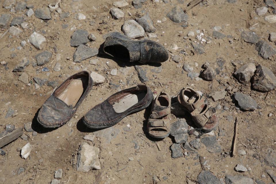 Shoes of victims lay on the ground at the site of a house destroyed by a Saudi-led airstrikes in outskirts of Sanaa, Yemen, Thursday, Feb. 16, 2017. At least one Saudi-led airstrike near Yemen's rebel-held capital killed at least five people on Wednesday, the country's Houthi rebels and medical officials said. (AP Photo/Hani Mohammed)