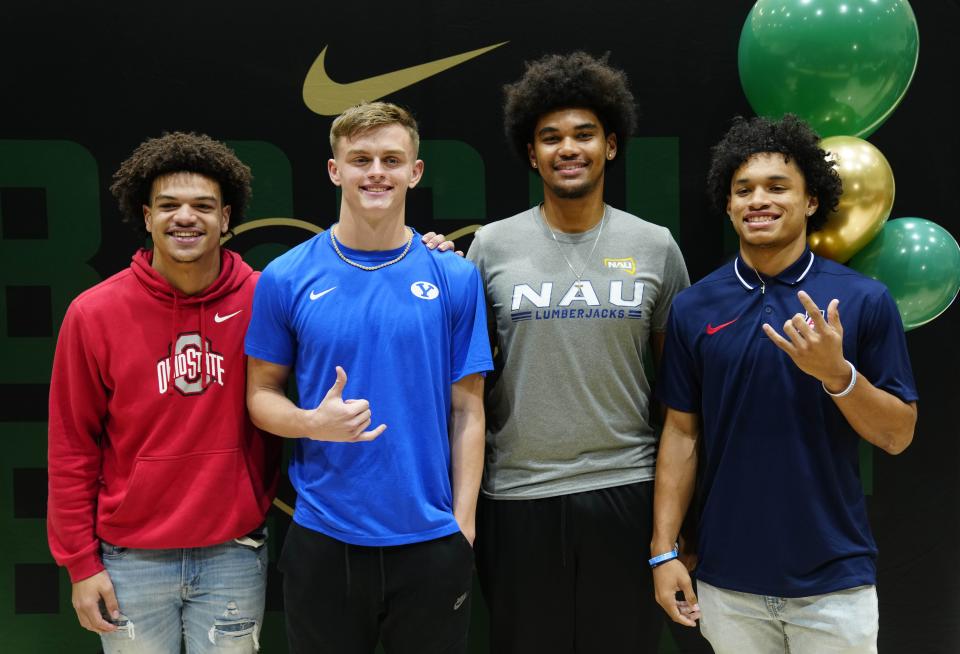 (Left to right) Basha's Miles Lockhart, Tommy Prassas, Javery Mayberry and Demond Williams pose for pictures during the NLI signing at Basha High School in Chandler on Dec. 20, 2023.