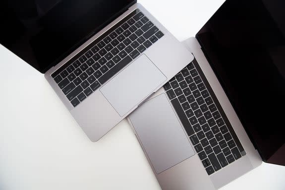 Two recent MacBook Pros, side-by-side.