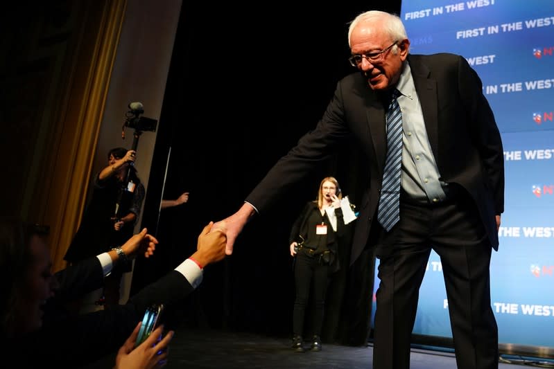 Bernie Sanders shakes hands on stage at a First in the West Event at the Bellagio Hotel in Las Vegas