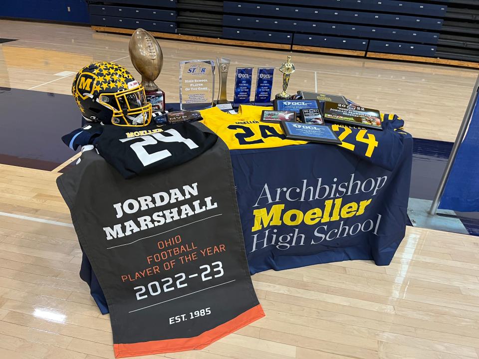 Some of the awards and memoribila of Jordan Marshall's career as Moeller senior Jordan Marshall was given the trophy for Ohio Mr. Football by the Ohio High School Athletic Assocation Dec. 6, 2023 in the Moeller gymnasium.