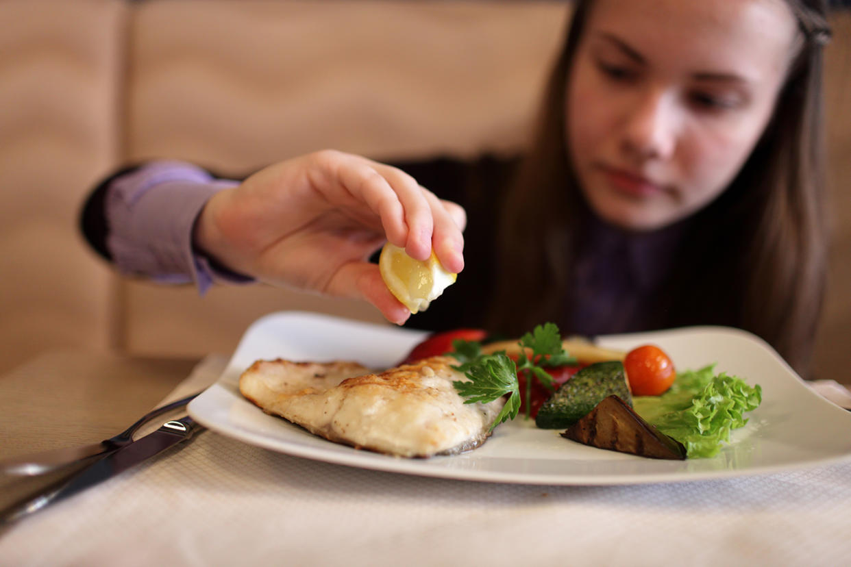 A new study shows that eating fish may improve children’s IQ by helping them sleep better. (Photo: Getty Images)