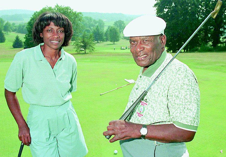 Bill Powell and his daughter Renee are seen on the 16th green of their Clearview Golf Club in an undated photo.